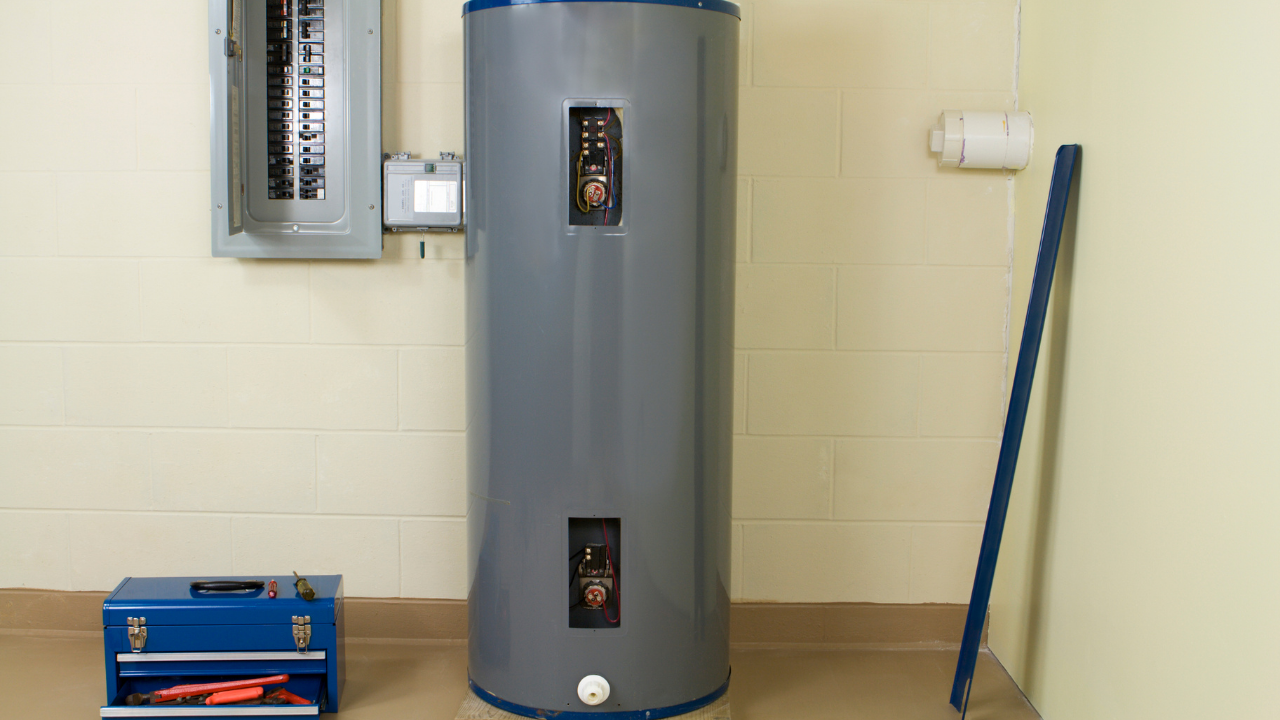 Licensed HVAC technician inspecting furnace in Fresno, CA