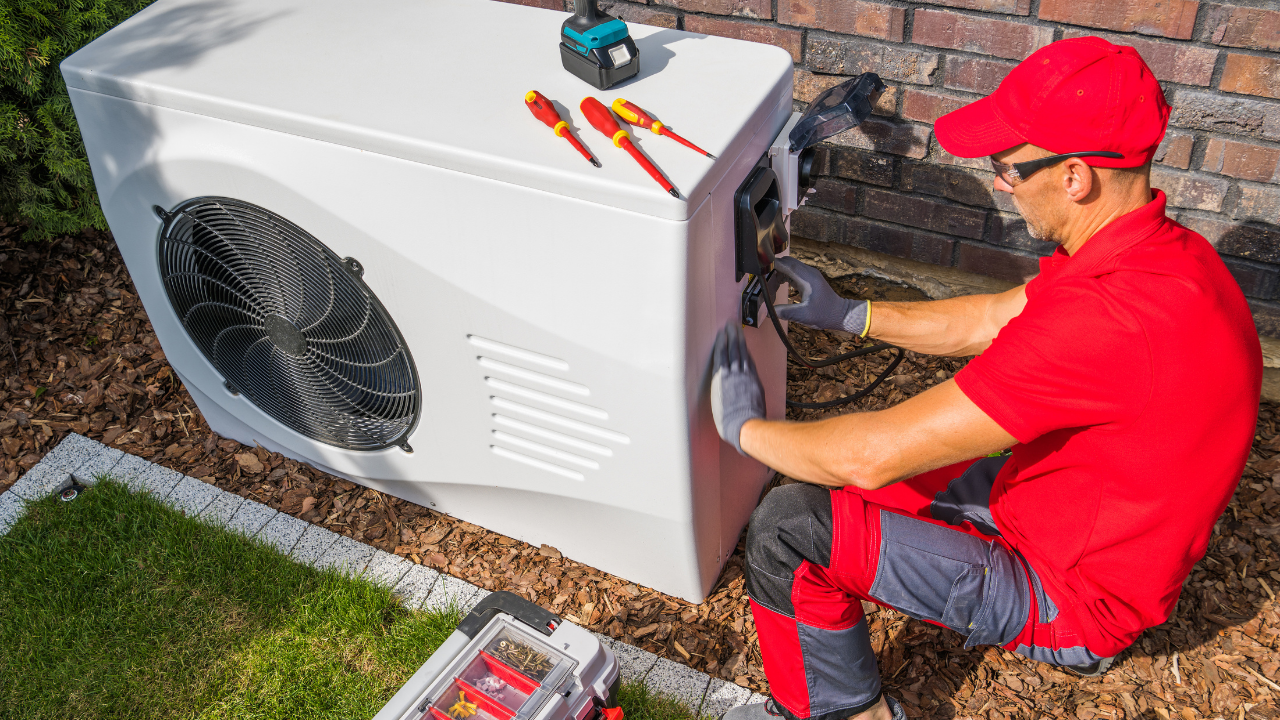 Technician performing multi-point AC tune-up inspection