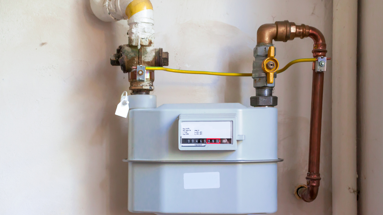 AC and heating technician repairing outdoor unit in Fresno, CA
