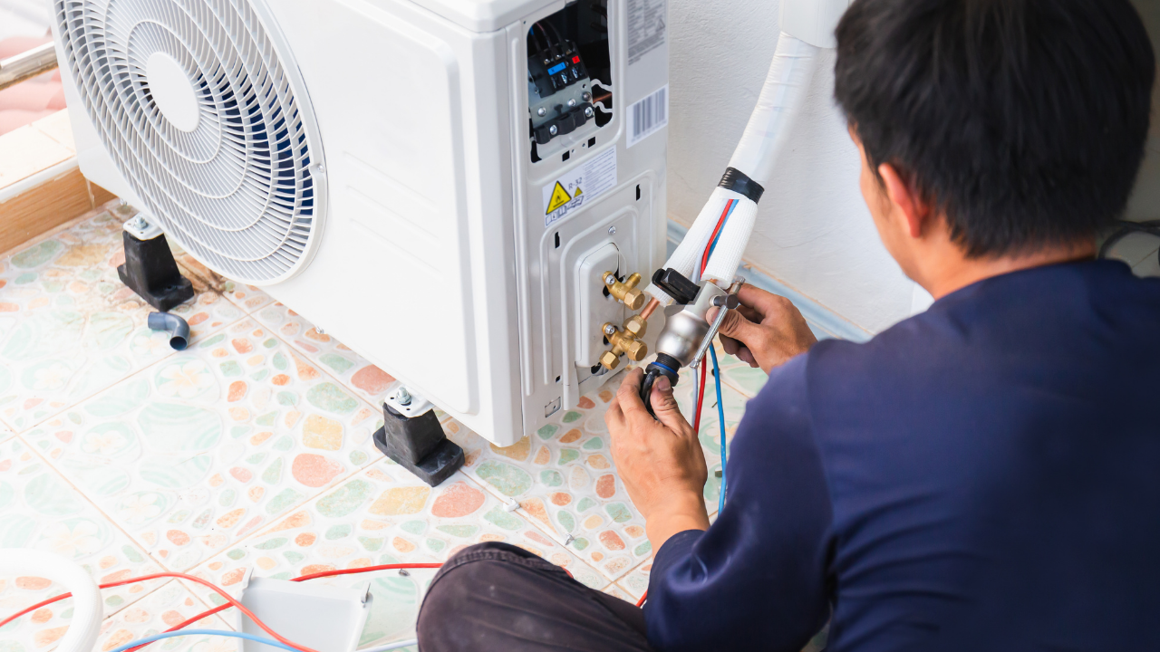 Technician explaining AC repair options to homeowner